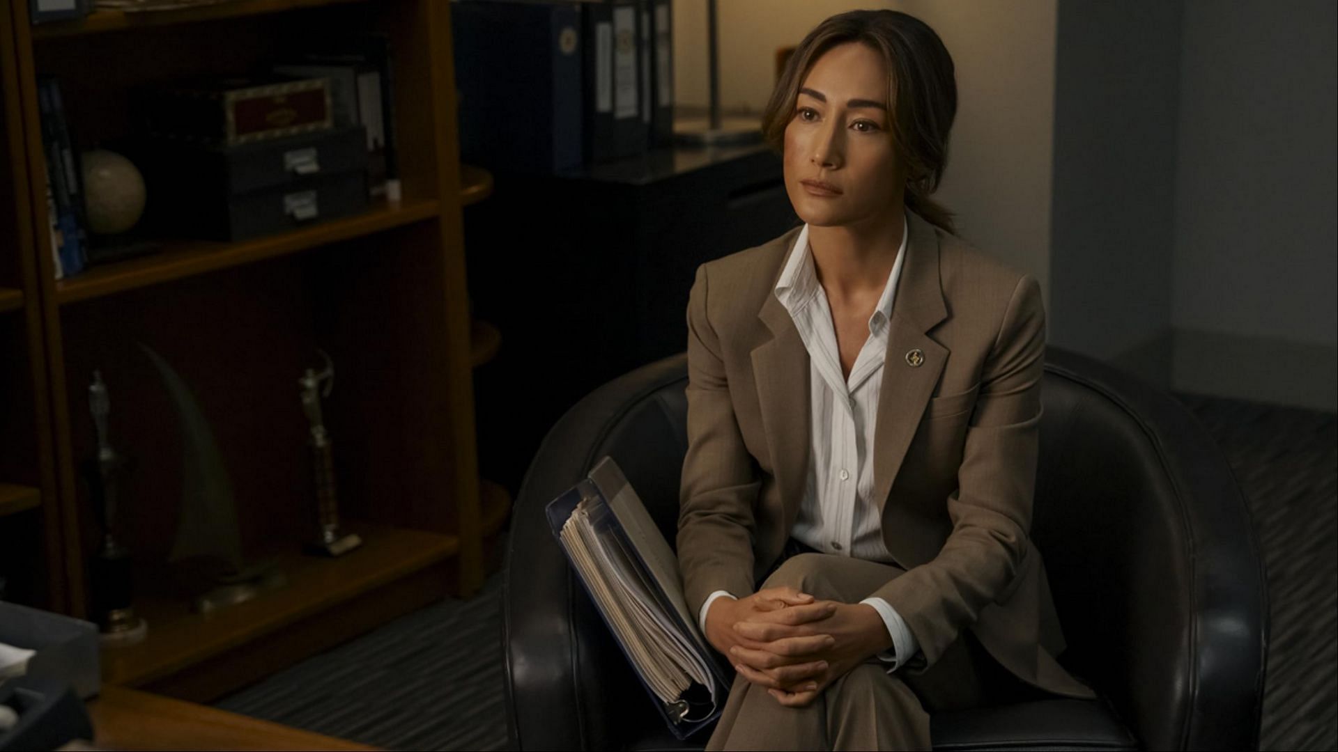 In Ballard season 1, Renee Ballard sits quietly as her world unravels, leaving viewers desperate to know what comes next. (Image via Prime video)